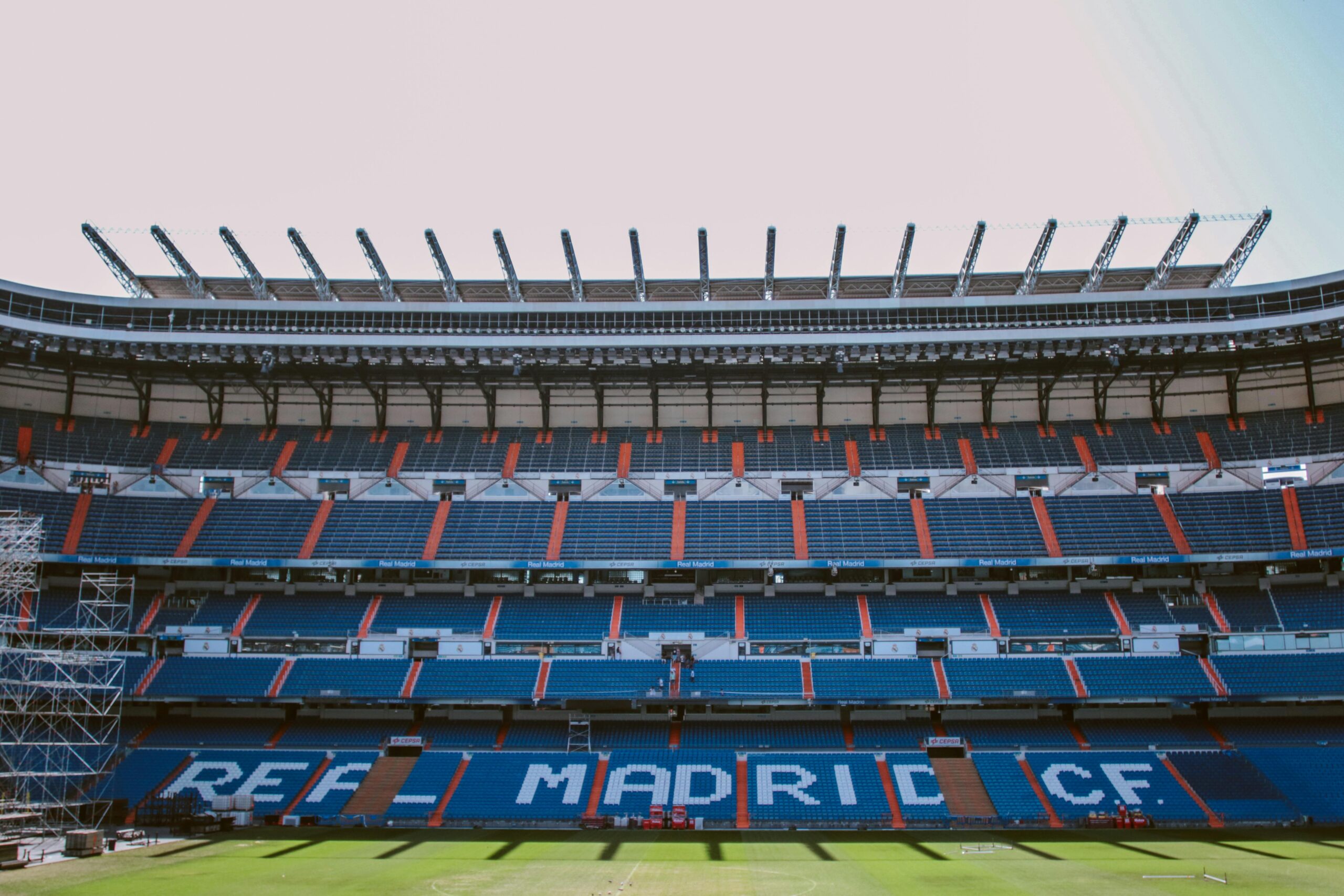 Empty stands of Santiago Bernabéu Stadium in Madrid, showcasing Real Madrid CF's seats.