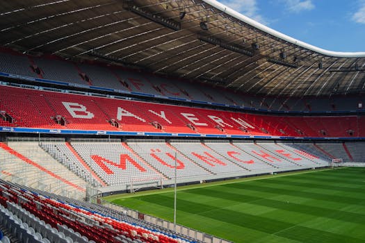 Explore the iconic Allianz Arena in Munich, home to FC Bayern, captured empty and sunlit.